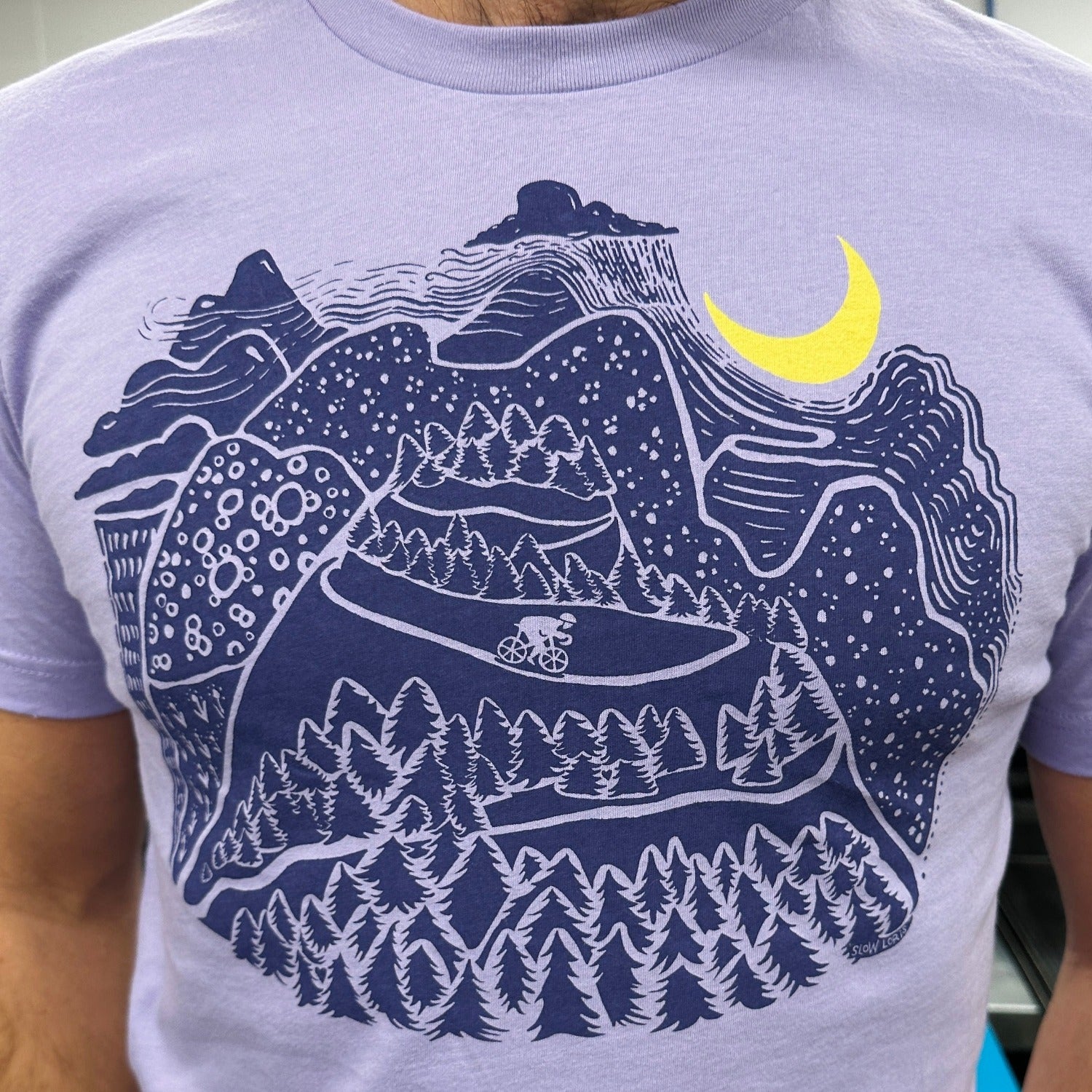 Night Ride print in dark blue ink. Mountain scene with raincloud, crescent moon, and bicyclist riding down the mountain