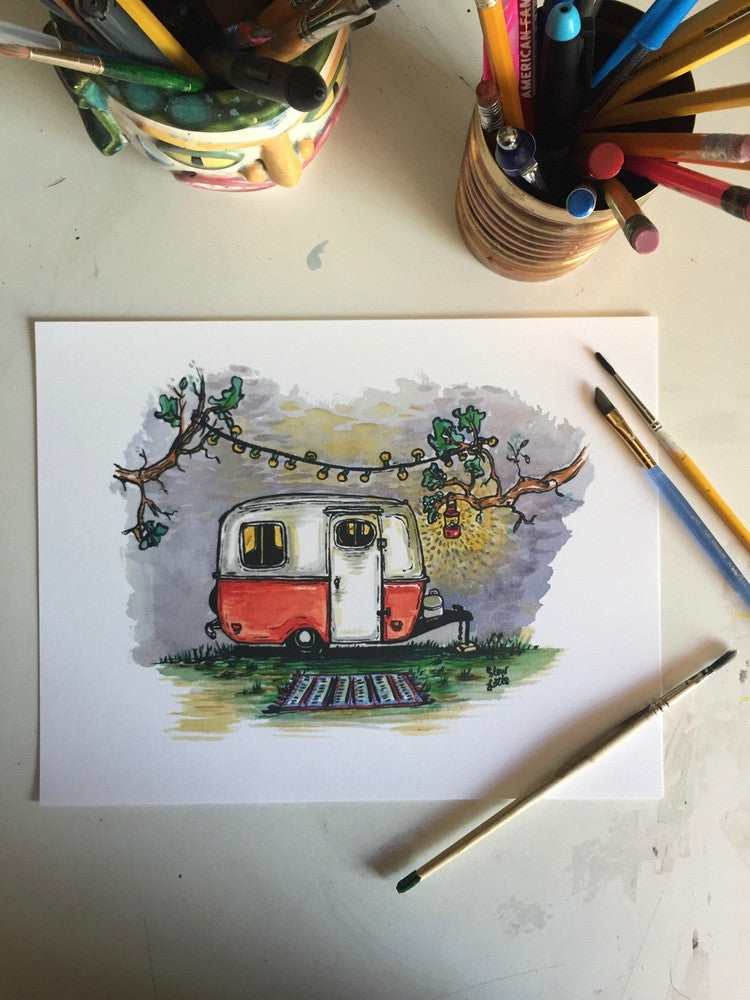 Original art for boler camper trailer print, lying on desk with brushes and pens.