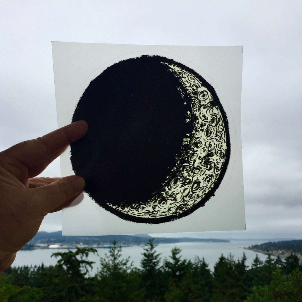 A large vinyl "stained glass" sticker in the shape of the waxing crescent moon.