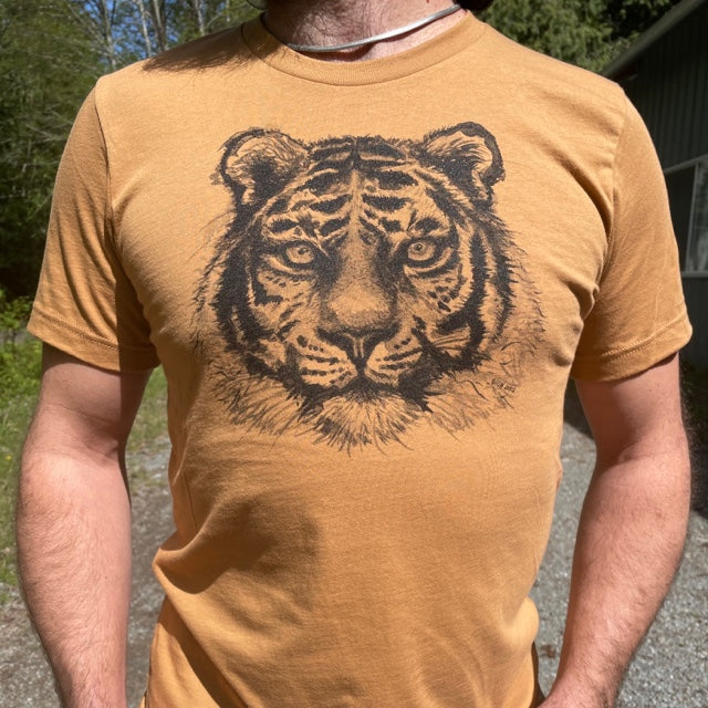 T shirt printed with a large tiger face, modeled on a man's chest.